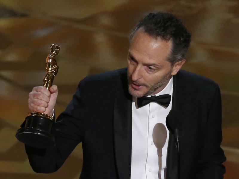 Emmanuel Lubezki celebrates with his Oscar for Best Cinematography for the movie "The Revanant" at the 88th Academy Awards in Hollywood