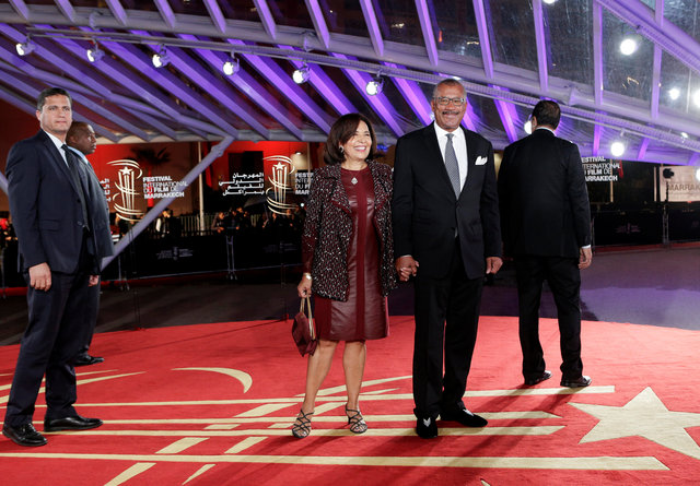 U.S. ambassador to Morocco Dwight L. Bush poses with his wife Antoinette as they arrive at the opening ceremony of the 16th Marrakech International Film Festival in Marrakech