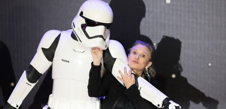 file-photo-carrie-fisher-poses-for-cameras-as-she-arrives-at-the