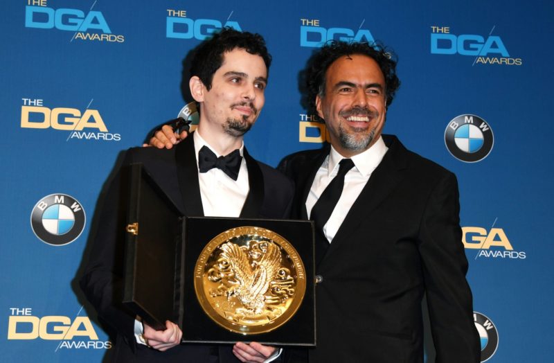 Damien Chazelle , winner of the Best Director in a Feature Film award for "La La Land," poses with last year's winner director Alejandro G. Inarritu, in the press room at the 69th Annual Directors Guild Awards (DGA) in Beverly Hills, California 